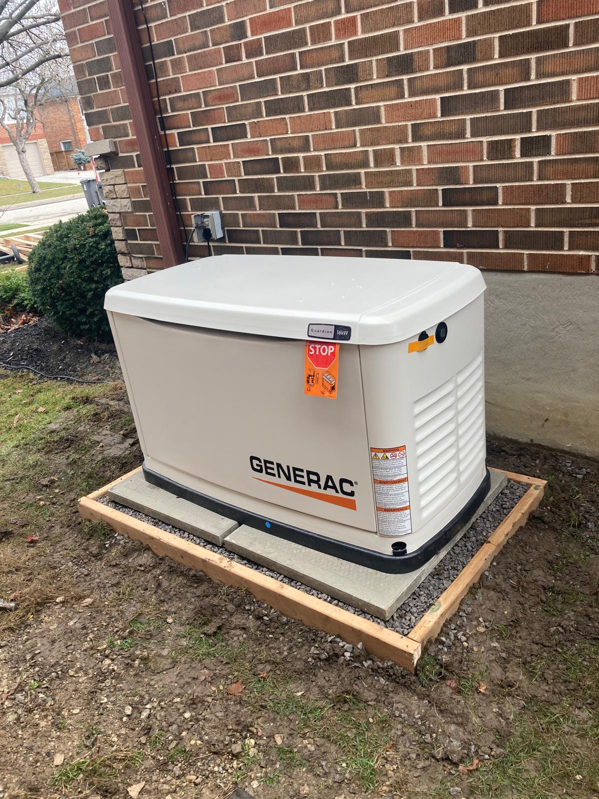 Home standby generator installation on a leveled gravel pad with a wooden frame by Brampton HVAC experts.