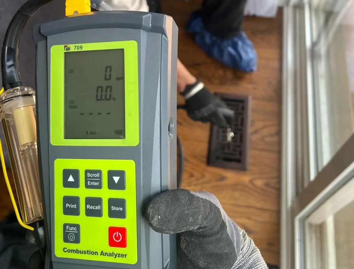 TSSA-registered furnace repair technician performing a combustion (CO₂) safety test in Brampton