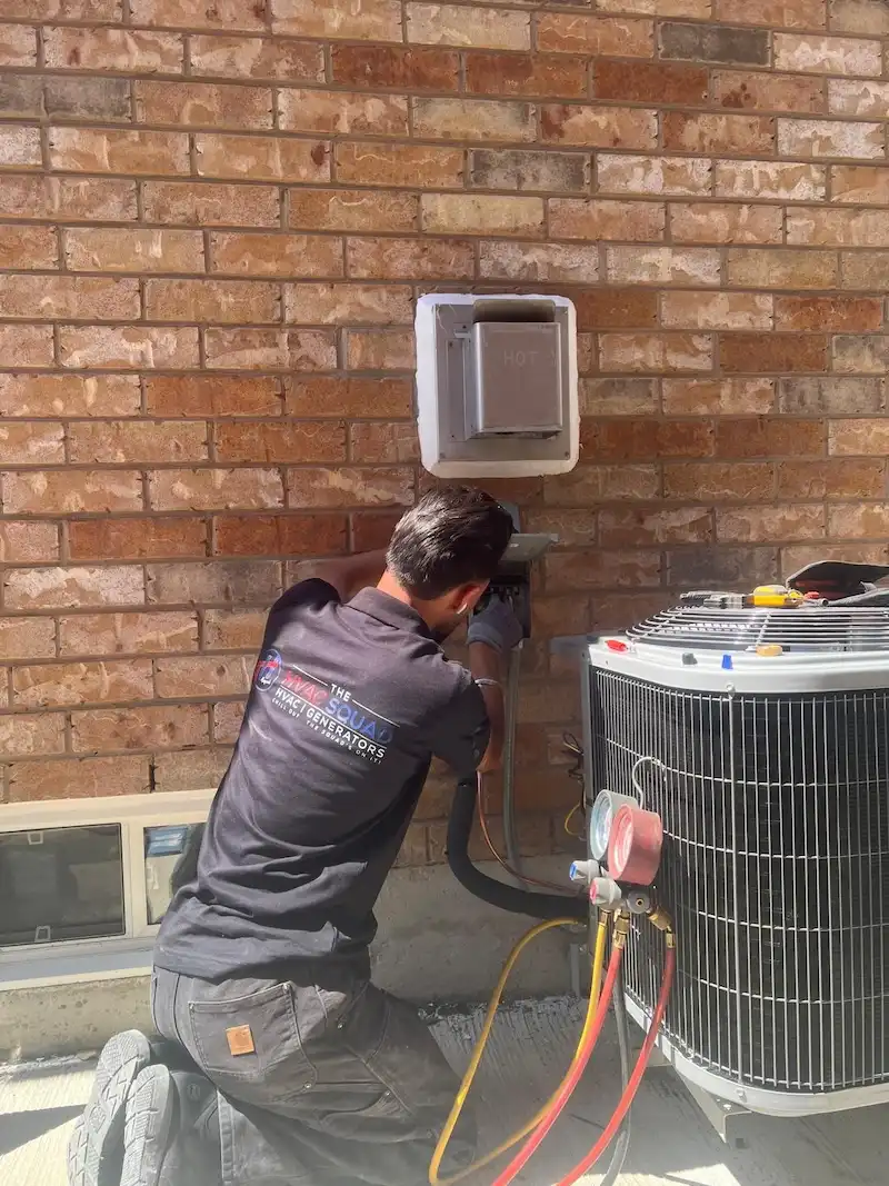 Technician repairing an air conditioner in Brampton
